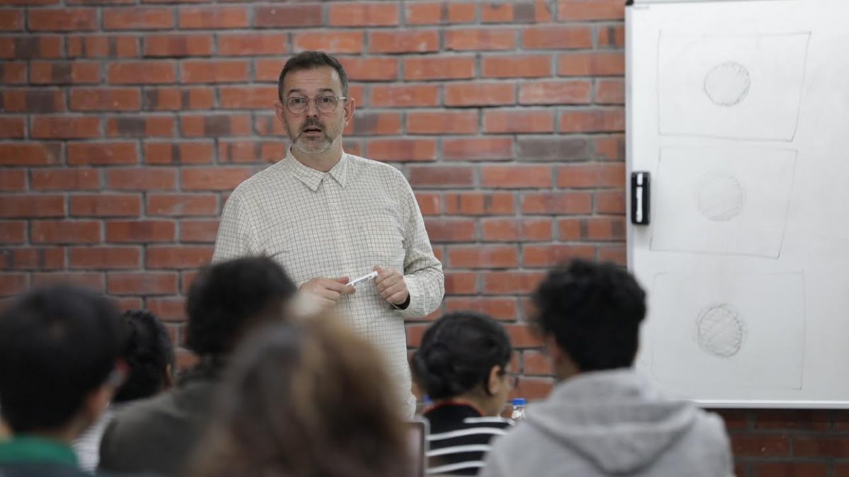 Dr Jake Abrams from Kingston University interacts with students of Communication Design.