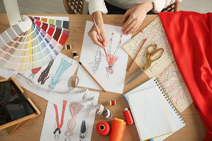 Fashion designer sketching outfit ideas