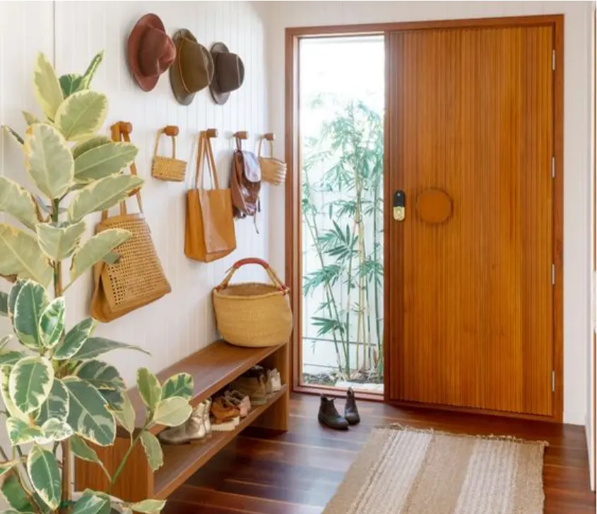 mirror for a touch of glamour, or incorporating a small shoe rack to keep things tidy