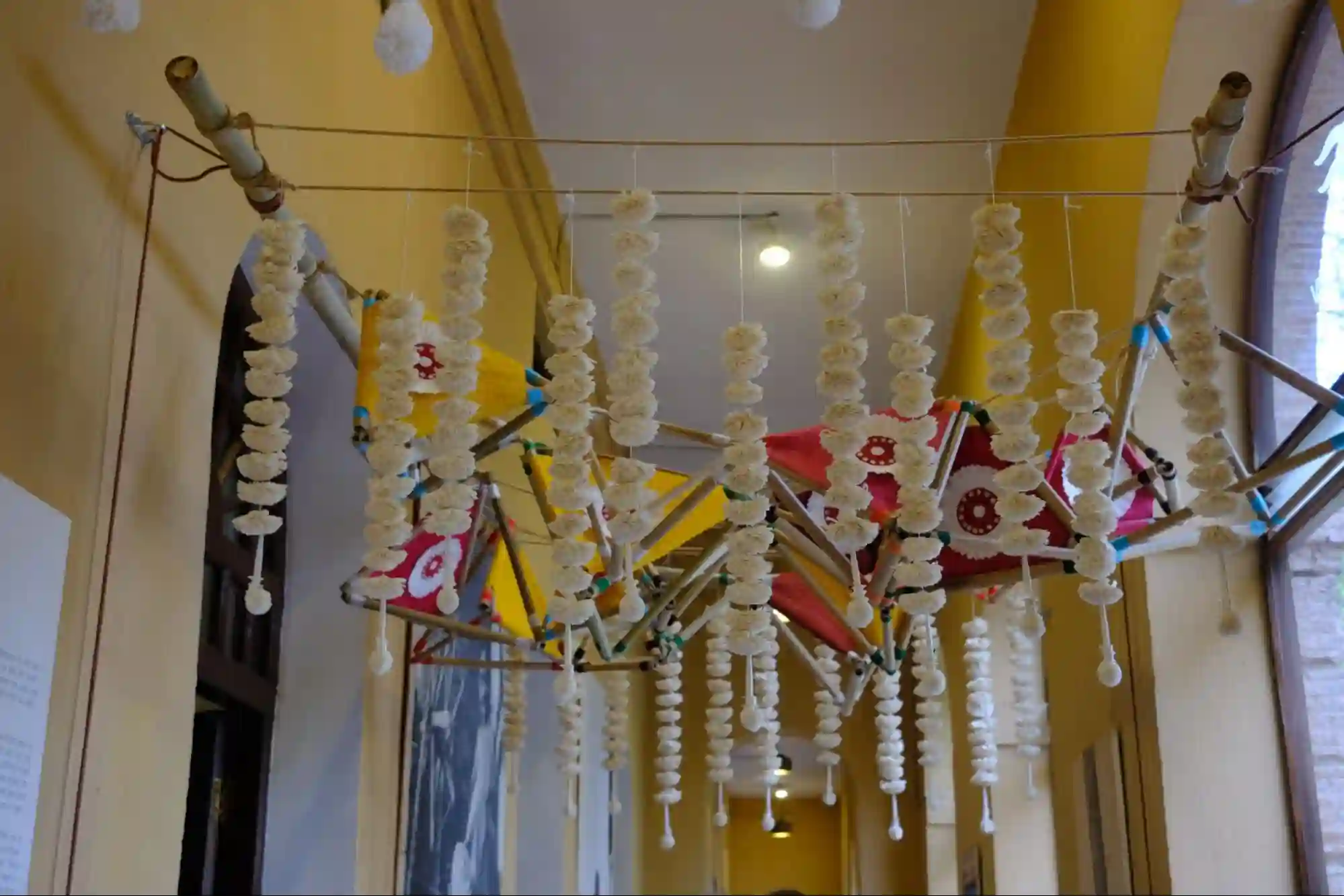 Traditional kadamb garlands hung in vertical clusters