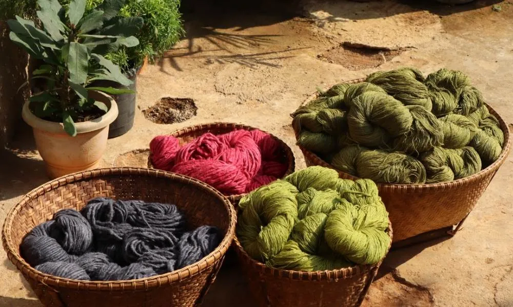 Natural dyed yarns in earthy tones for Ayurvastra textiles
