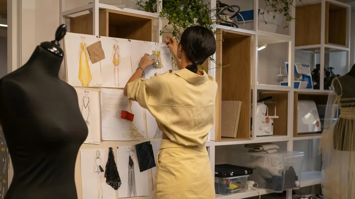 Fashion design student working on sketches