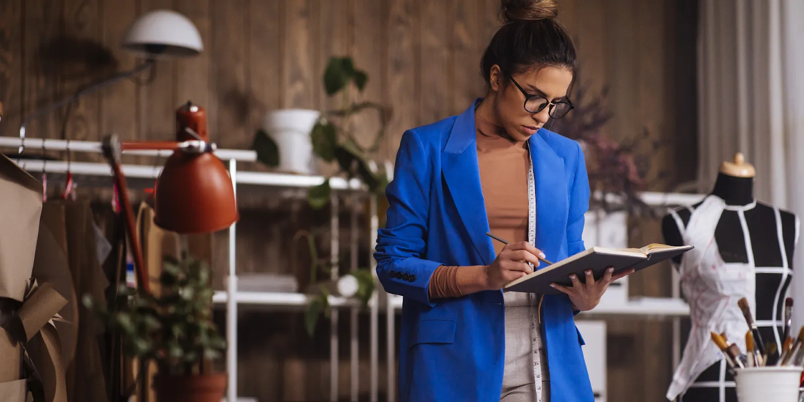 Fashion designer with notebook